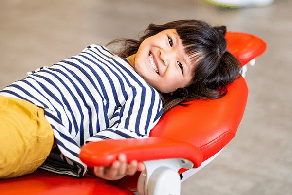 child sitting in dental chair at Grin Pediatric Dentistry and Orthodontics